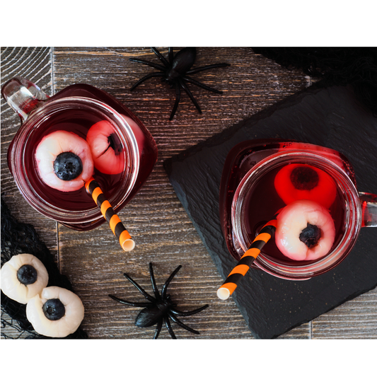 Berry punch with eyeballs made out of lychees and blueberries.
