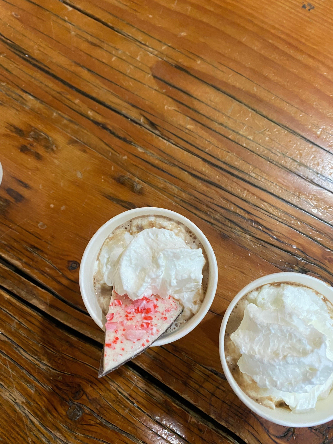 Hot chocolate with whip cream and peppermint bark