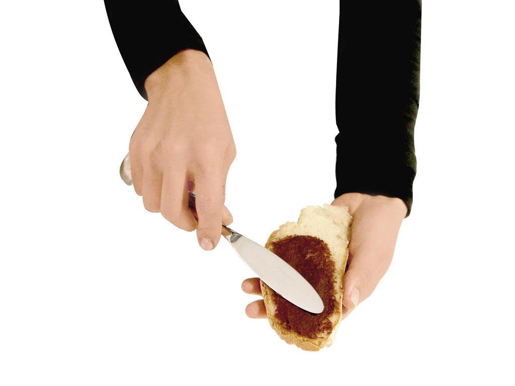 IPAC "Tirso" Standing Spreading knife in use, spreading jam on toast.