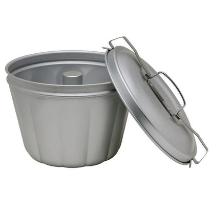 Mrs. Anderson's Steamed Pudding Mold with the lid off and resting on the side of the mold